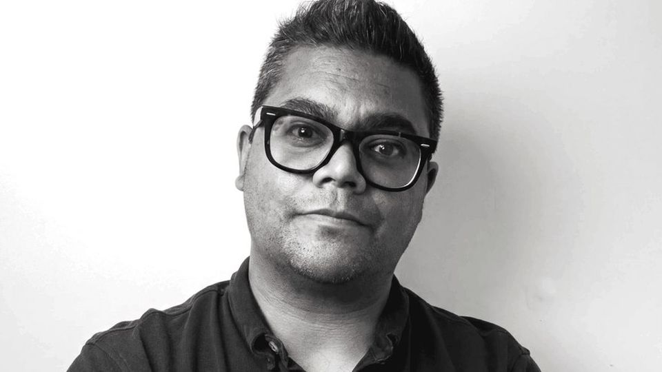 Michael Sathorar, who builds every Savvy website, looking at the camera